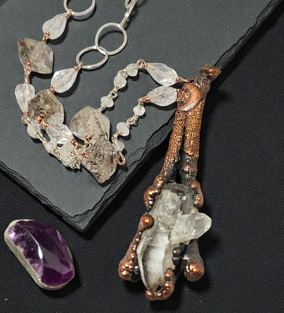 A high-end copper electroformed necklace featuring a clear quartz cathedral nestled in boxwood twigs, hanging from a hand-beaded sterling silver and quartz rosary chain.