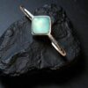 Sterling silver cuff bracelet with Blue Green Chalcedony cabochon.
