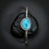 Sterling Silver and Larimar cuff bracelet with a background of black slate