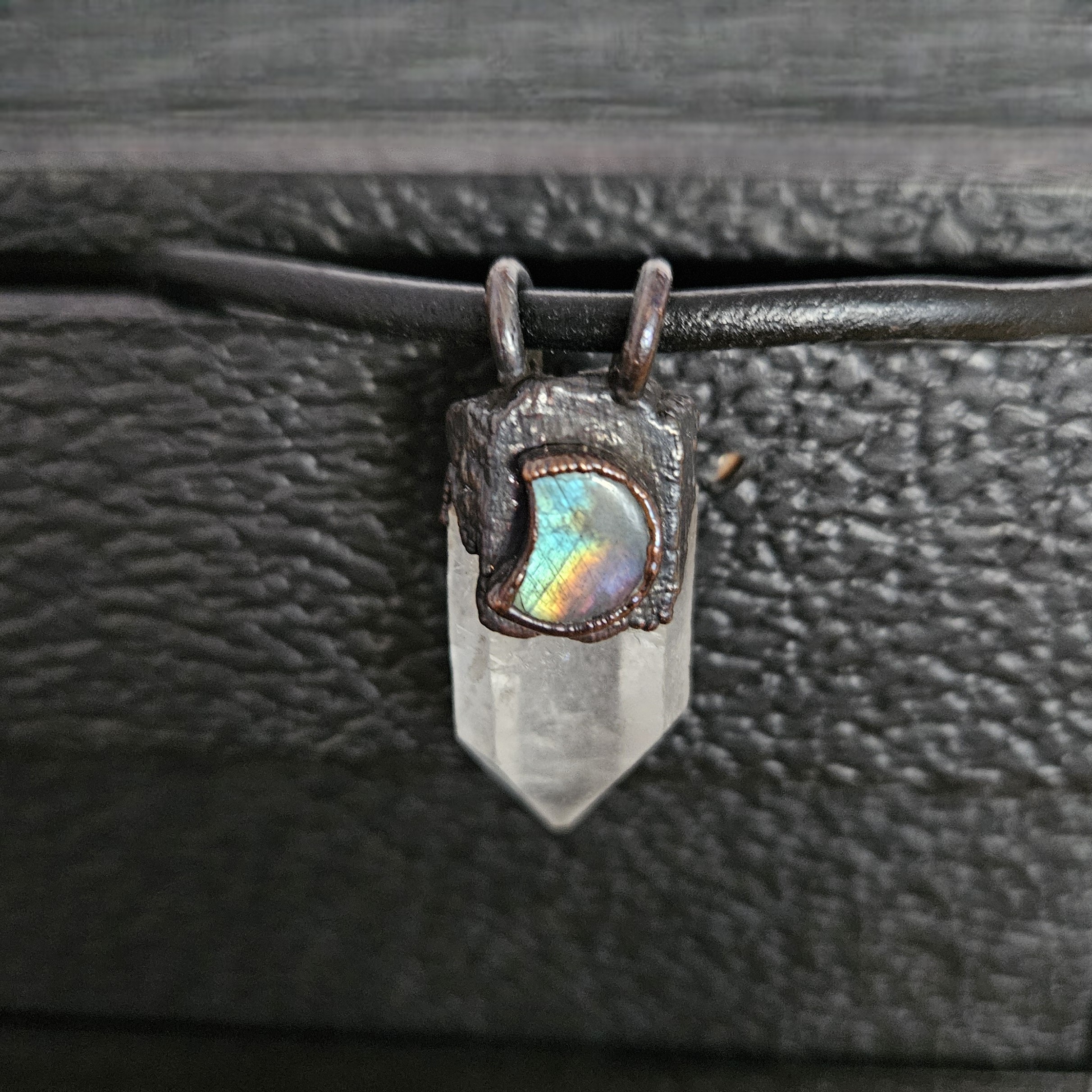 Closeup of the Navigator Amulet that shows the flash (Adularescence) of the Labradorite stone.