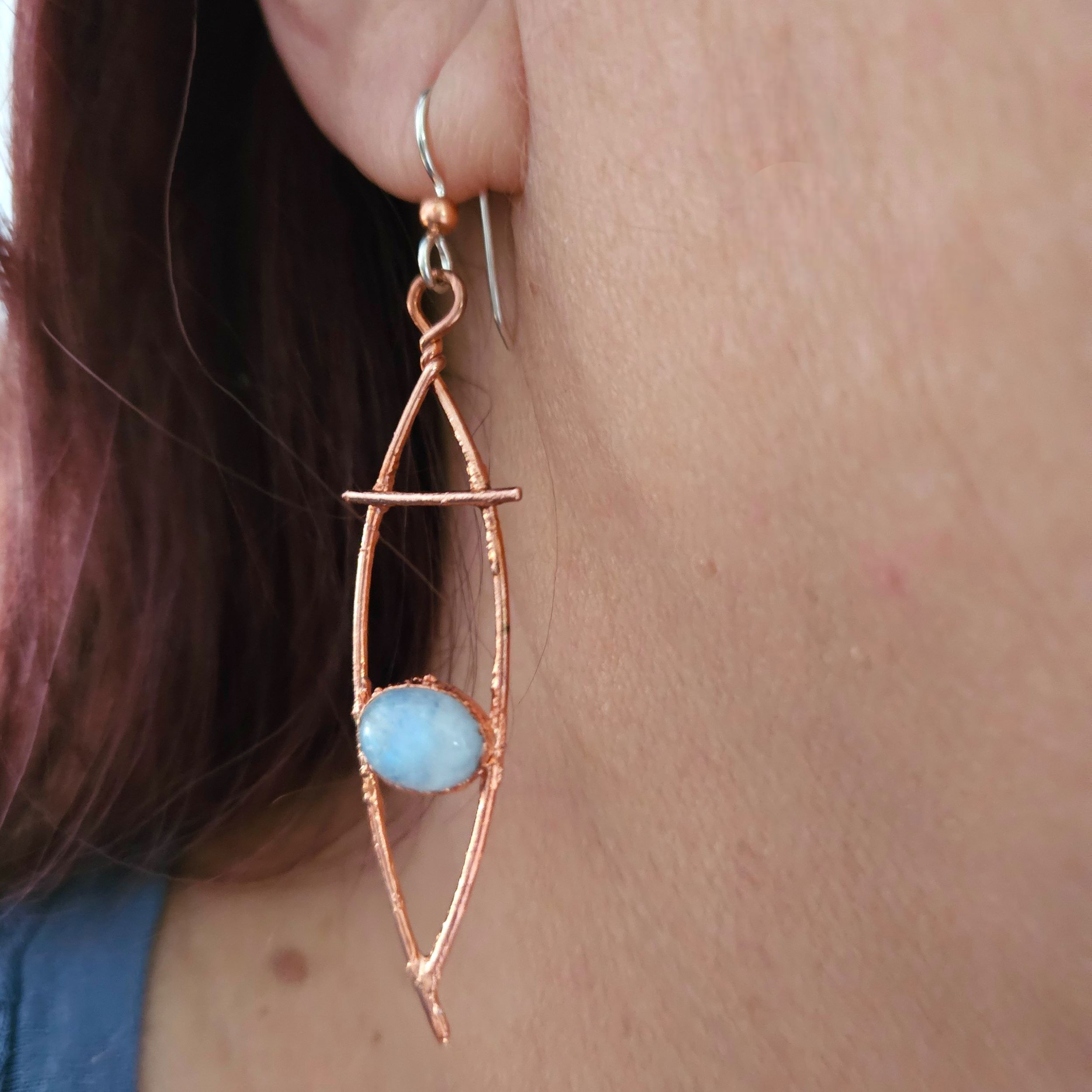 The 2.25-inch Stellar Flash earrings shown on model to show the elongated, lightweight silhouette.