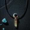A long copper electroformed talisman featuring a smoky quartz point, turquoise accent, and mother of pearl moon.