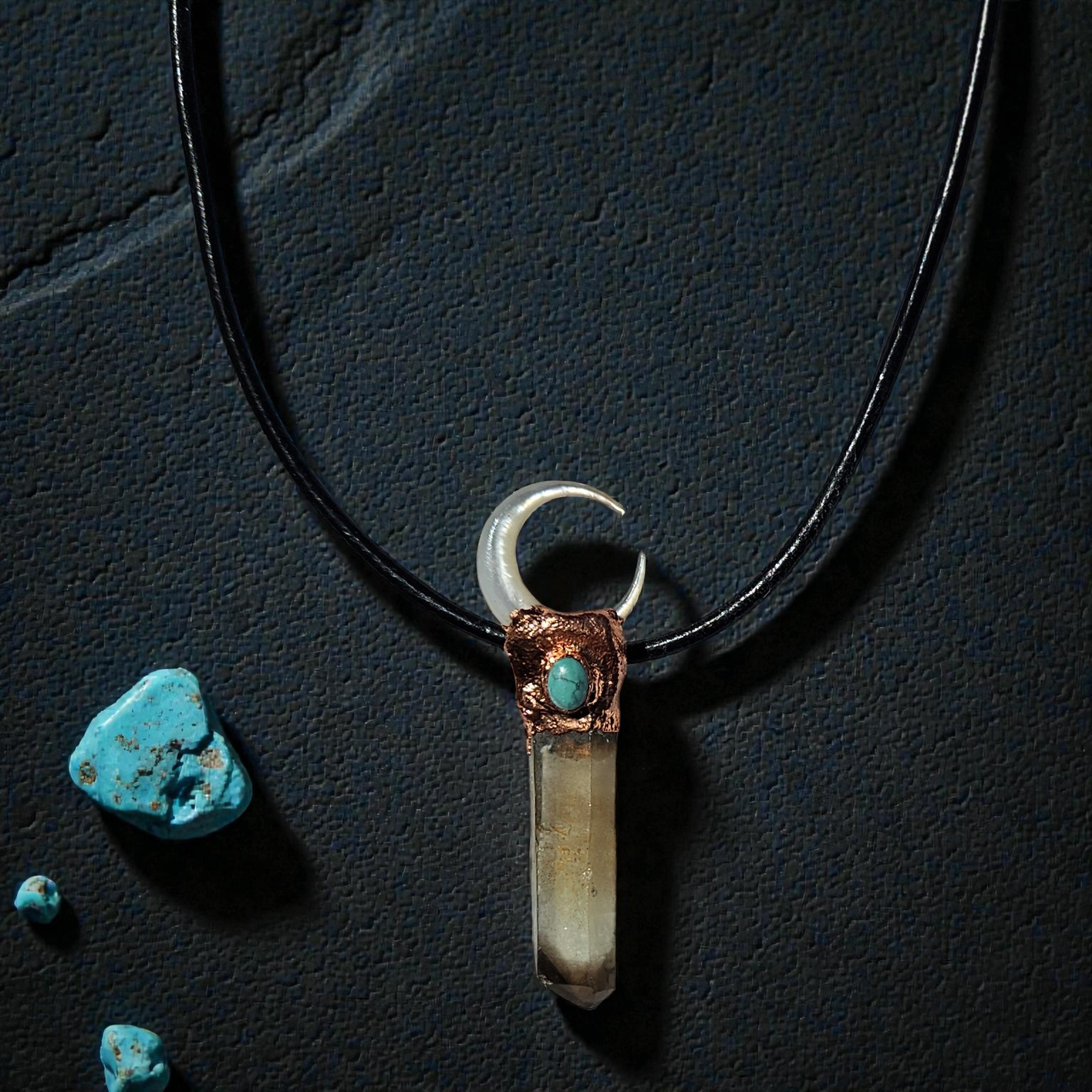 A long copper electroformed talisman featuring a smoky quartz point, turquoise accent, and mother of pearl moon.