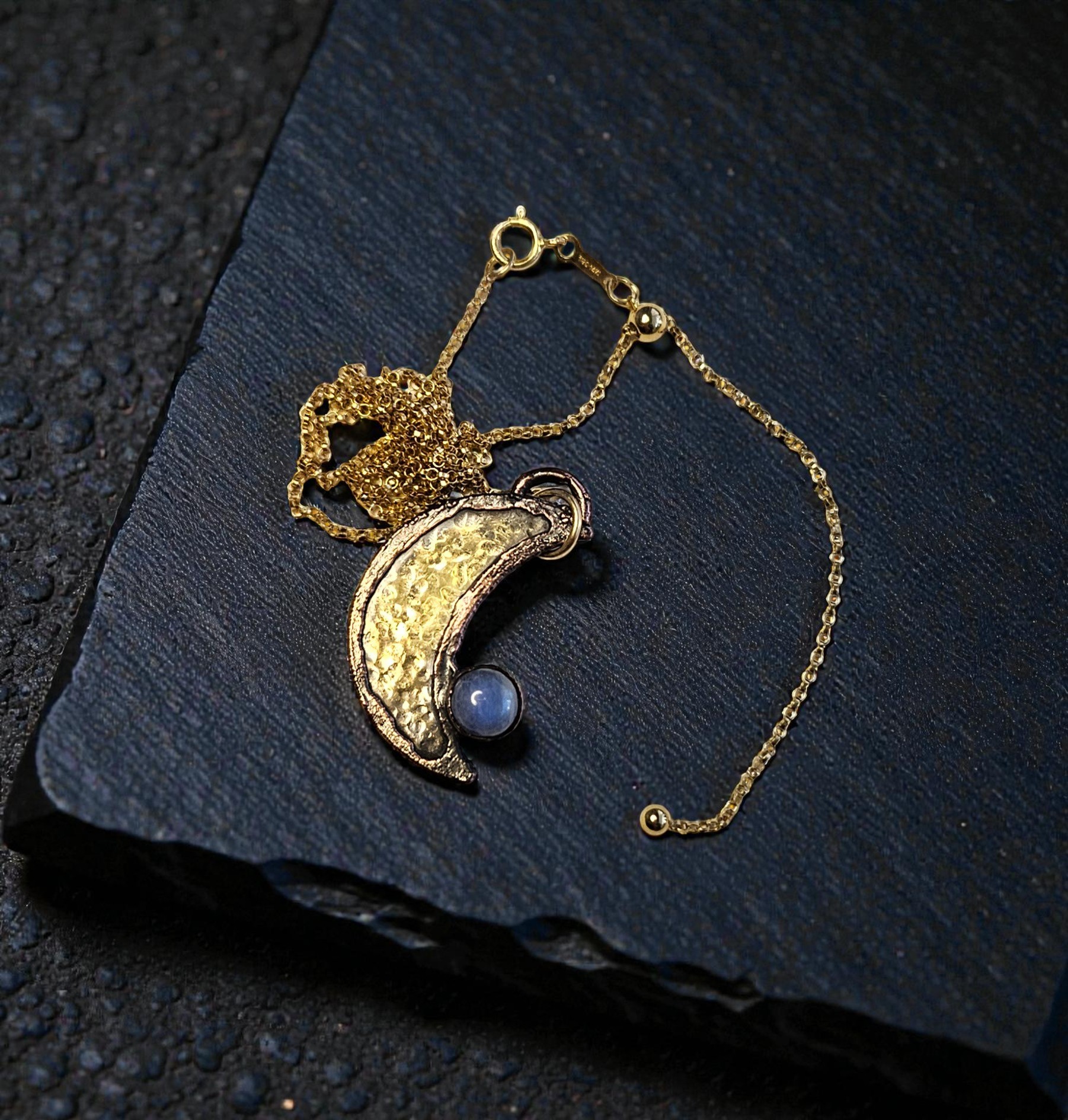 Detail of the 14kt gold-filled adjustable slider bead chain, showing how to customize the length of the Lunar Veil Amulet.