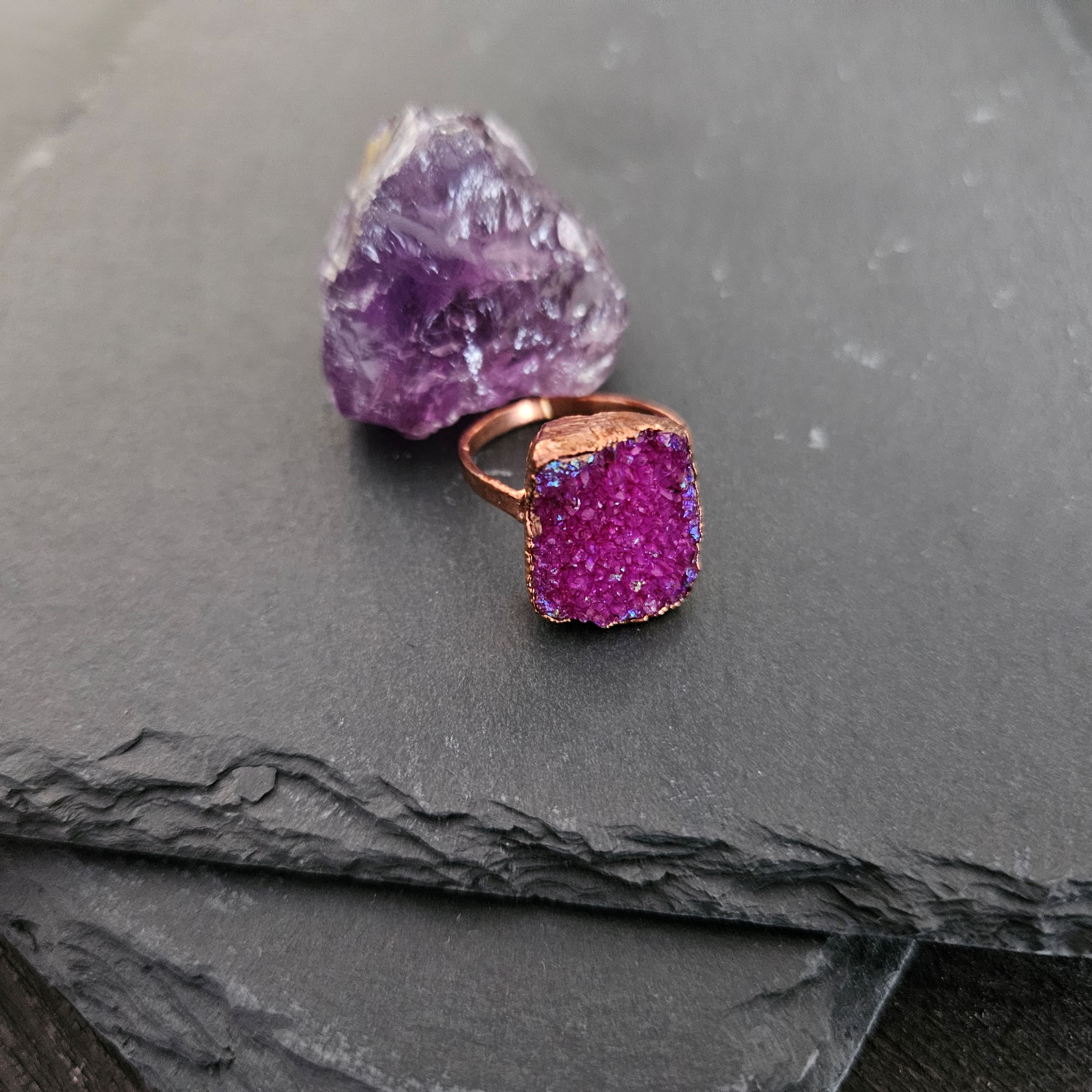 A square pink aura druzy ring styled with a raw amethyst stone to highlight heart chakra ritual energy.