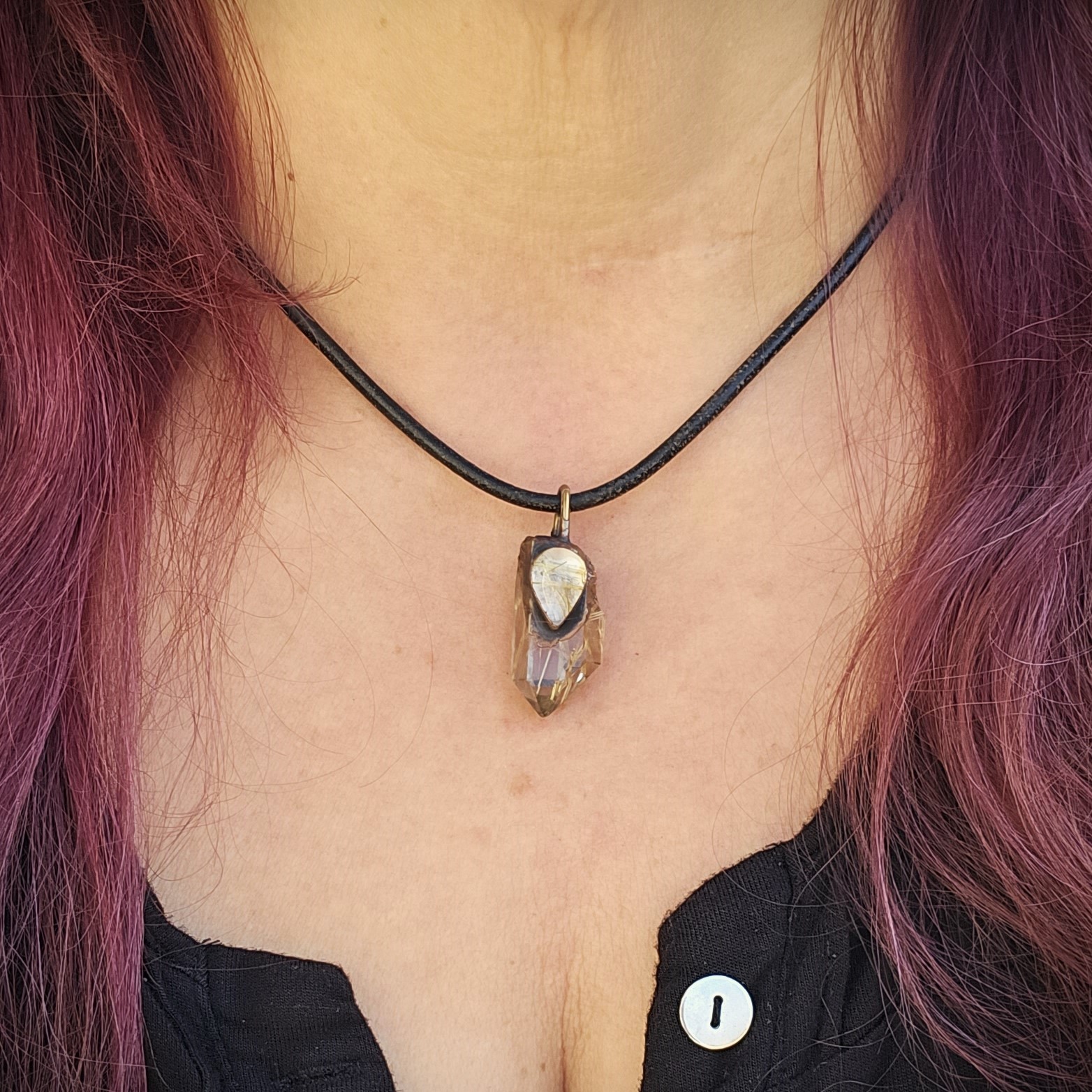 Rutile Relic amulet shown on model