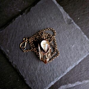 Golden Rutile Quartz Amulet on a Brass Chain