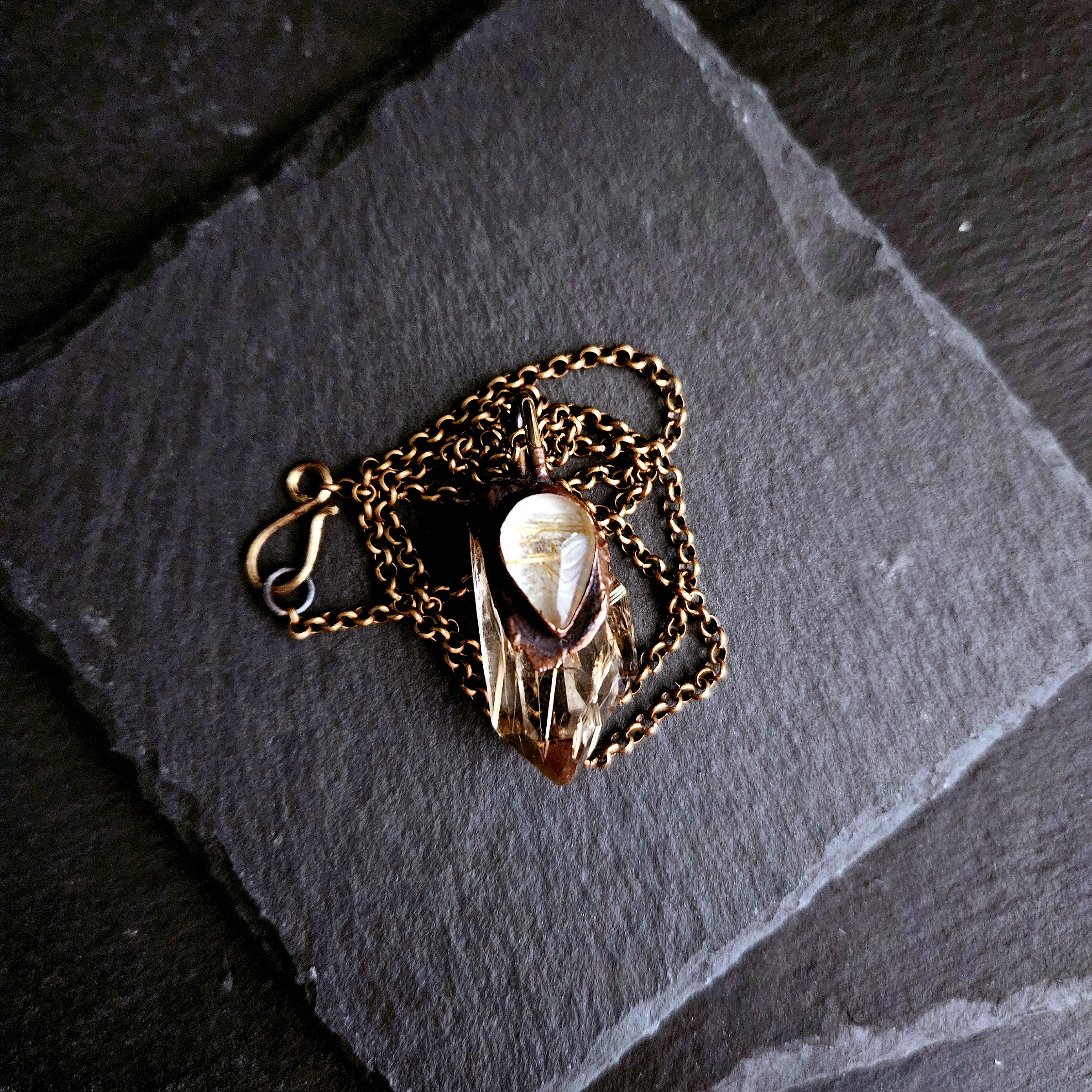 Golden Rutile Quartz Amulet on a Brass Chain