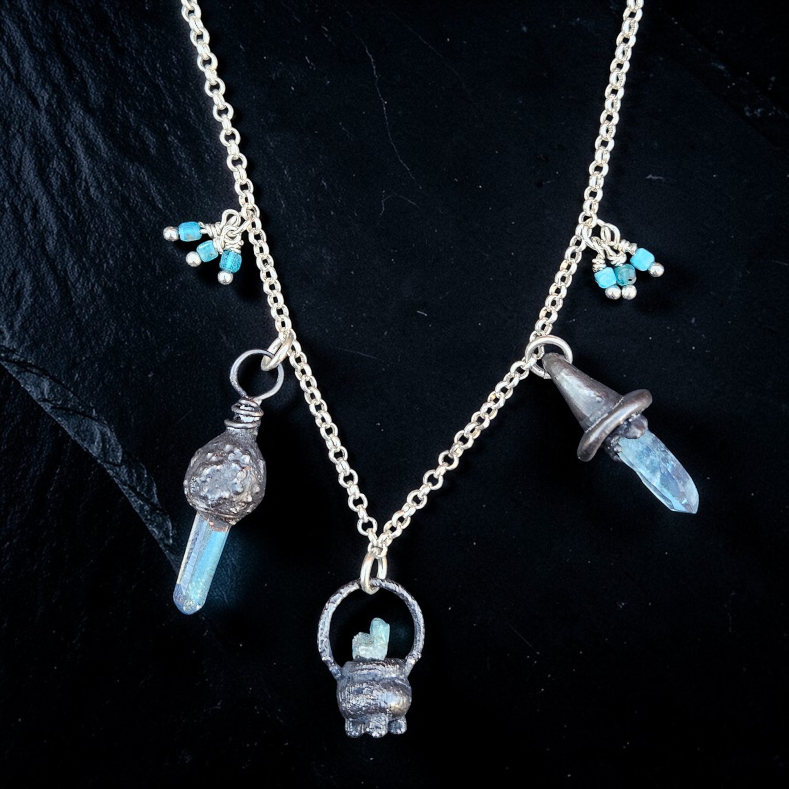 Sterling Silver and copper Charm Necklace featuring a cauldron with Aqua Aura quartz